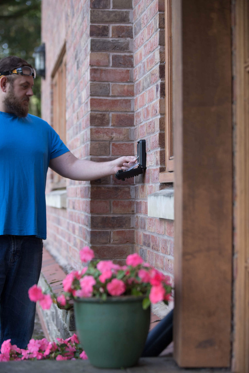 Man using key safe outside house, Key Safe Company