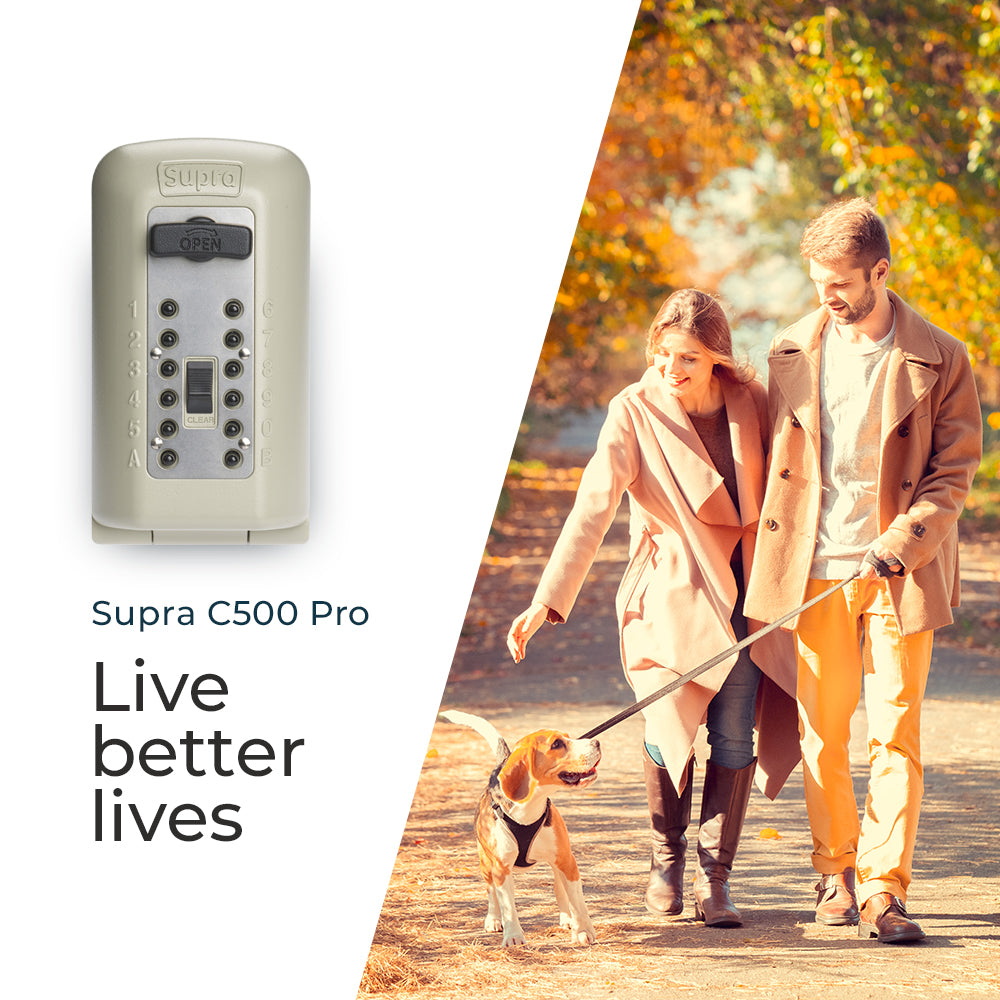 Police Preferred key safe within an image of a couple walking their dog
