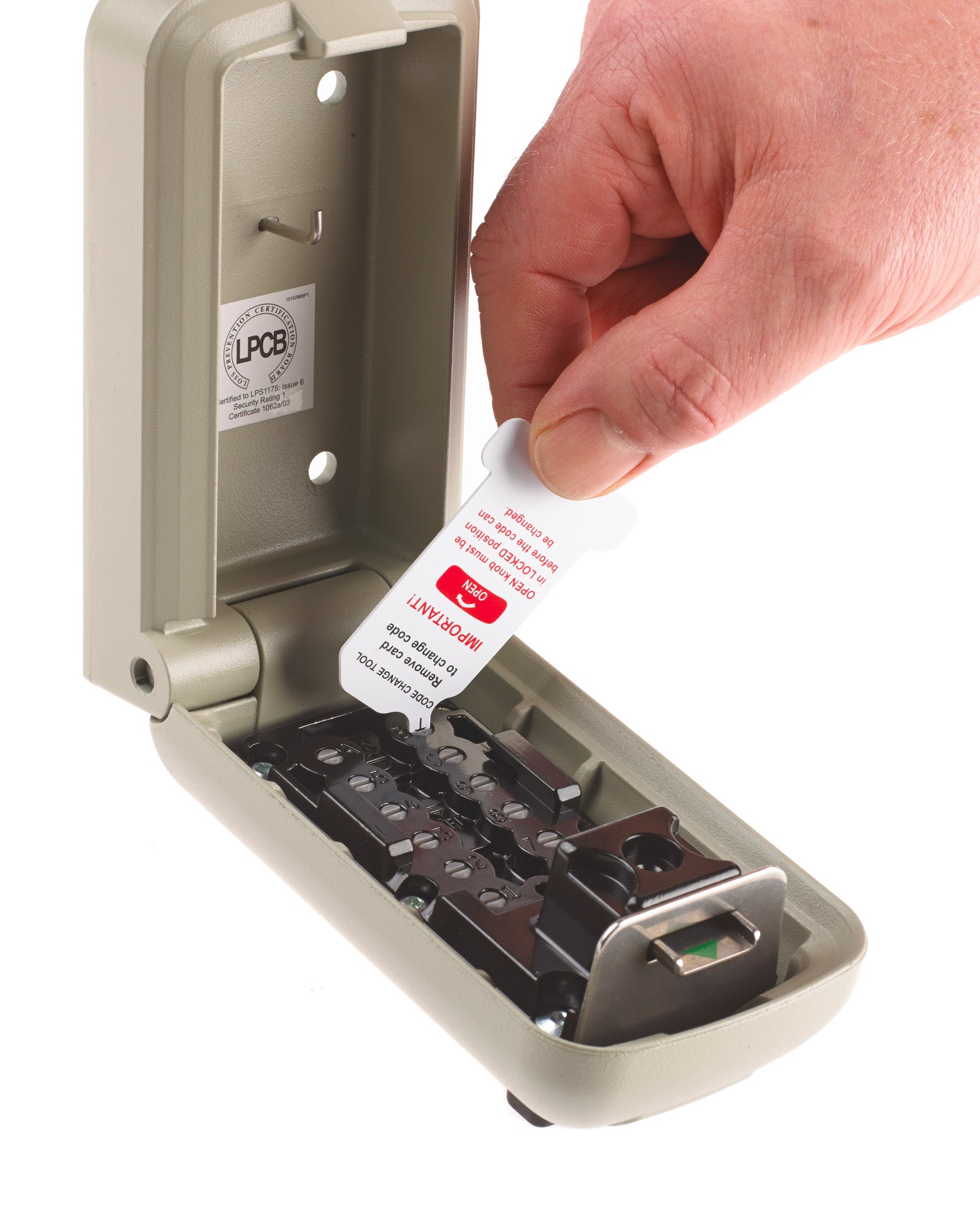 Open police preferred Supra C500 Pro key safe showing key hook and man using code changing tool to change his code