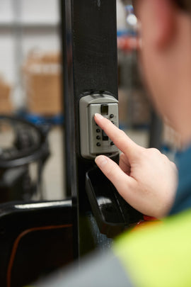 worker using the slimline key lock box