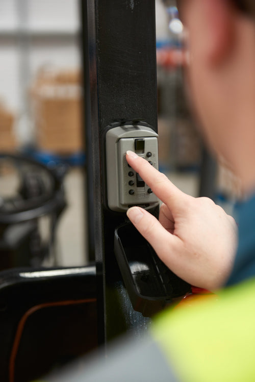 worker using the slimline key lock box