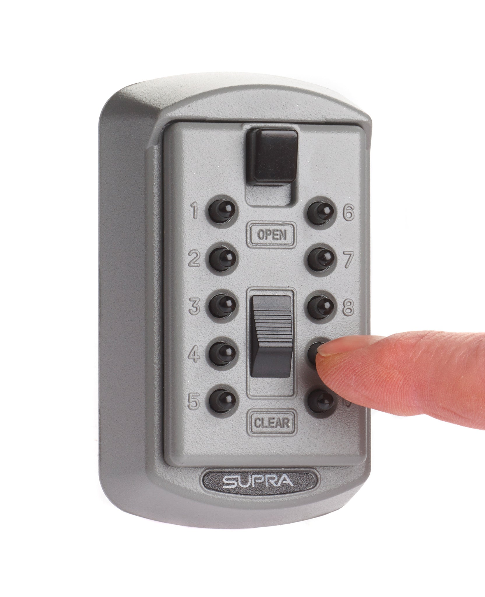Finger pressing 9 on silver Supra S6 slimline key safe made from zinc alloy